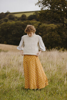 Hand block printed skirt and hand knitted vest inspired by slow living