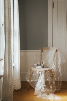Floral veil draped over a chair