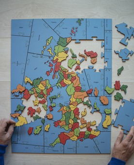 A partially made Counties of the British Isles Jigsaw Puzzle, with the sea cut into Sea areas. 