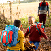 two small boys wearing magnetic backpacks