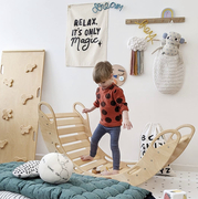 A fun and playful nursery and modern interior with knitted wall words hanging on the wall