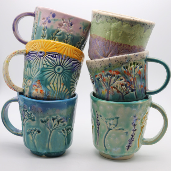 Stacks of Kezia May Ceramics mugs