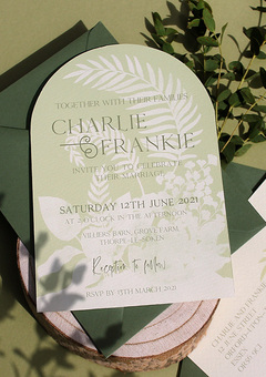 A fresh green arched wedding invite.