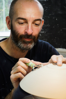 Turning a white ceramic bowl