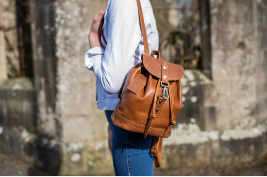 Timeless Tan: Mini Backpack modelled in an outdoor setting 
