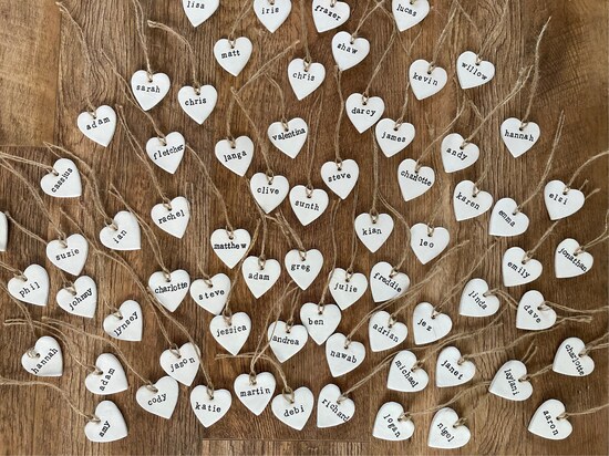 handmade clay hearts with names printed on each heart