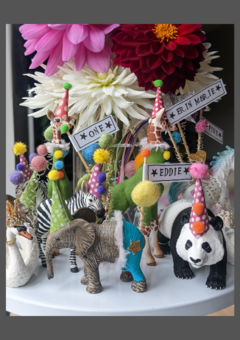 A collection of party animal cake toppers