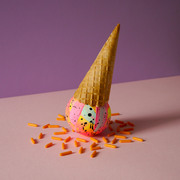 Hand-painted ceramic bauble creatively photographed to look like an ice cream cone