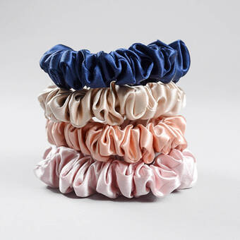 Pile of different coloured silk hair scrunchies