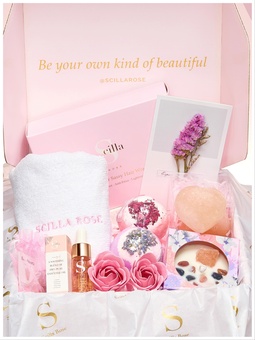 Self-Care Gift Hampers. This delightful gift hamper is perfect for the holiday season. It includes a scented candle, crystals, bath bombs, essential oils, a hai