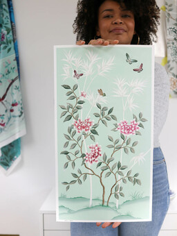 Diane holding one of her chinoiserie prints