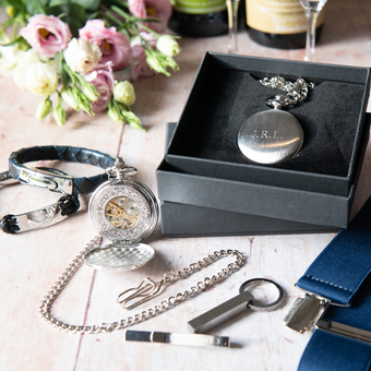 Pocket watch, leather bracelet, tie slide & key ring.