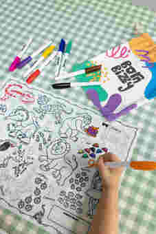 Child using reusable silicone drawing mat