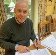 Sir Clive signing the limited edition prints