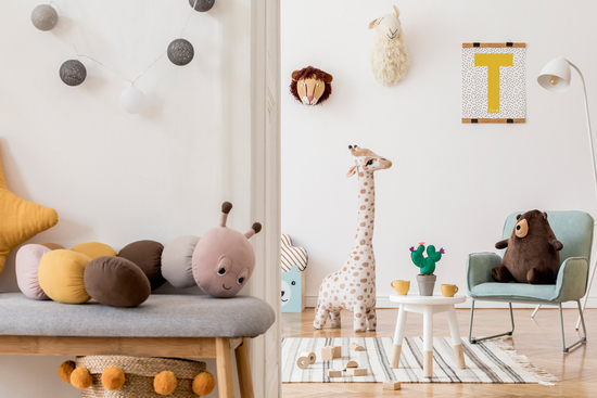 nursery room with animal decor and picture hanging on the wall