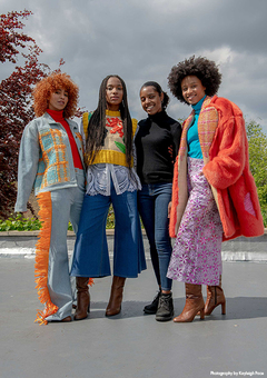 Image of Tihara Smith with three models wearing her Windrush collection
