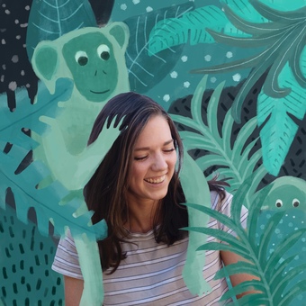 An illustrated monkey gets a shoulder ride from Illustrator designer Georgia Camden