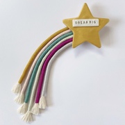 a rainbow shooting star with the words 'shine bright'