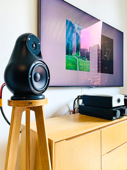 The image features the Jern Speaker on a specially shaped stand