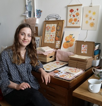 Photo of Bryony Moss, London Based illustrator sat at her studio in Peckham