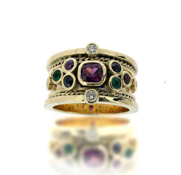 Gold drum ring with rubies, emeralds, diamonds, sapphires and amethysts