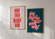 Two colourful posters in frames