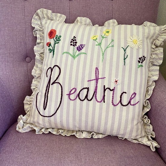 Hand embroidered ruffle trim stripe cushion with floral embroidery and personalised name 