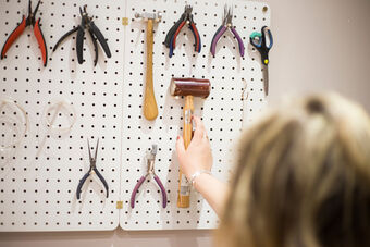Abigail Jewellery Selecting A Hammer from Peg Board Storage