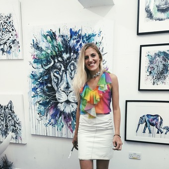A picture of me at my solo exhibition of animals, this lion is one of my favourite pieces. 