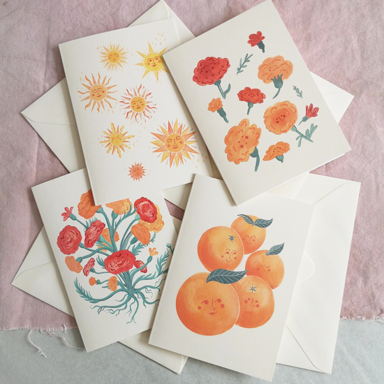 The sunshine collection card pack. A set of four illustrated greetings cards featuring oranges, suns and marigolds