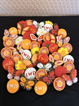 Corporate biscuits with logos flowers and butterflies with their company colours