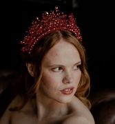 bride wearing red crystal headpiece