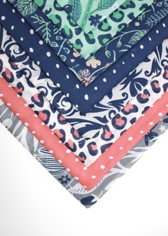 Selection of furoshiki fabric gift wrap patterns, and colours ranging from grey, though pinks and blushes, to navy and mint