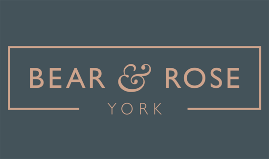 Inky Blue background with blush pink Bear & Rose logo - YORK.