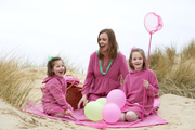 Party time on the beach, all wearing our Fuchsia/Apple stripes beach dresses