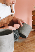 Sanding hand-cast recycled eco plant pot. Made in London