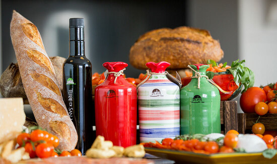 Our organic extra virgin olive oil in hand made, hand painted terracotta jars and bottles
