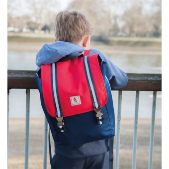 boy with red flap backpack