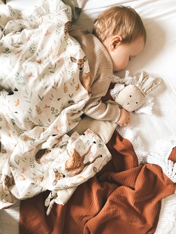 Keeping cosy in our woodland animal swaddle and tassel blanket