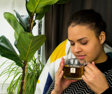 young woman drinking adaptogenic nootropic theenk tea