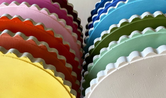 A rainbow of scalloped placemats