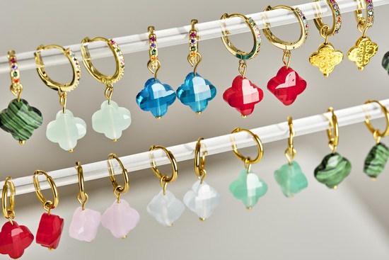 Gold hoop earrins with multicoloured glass clover charms