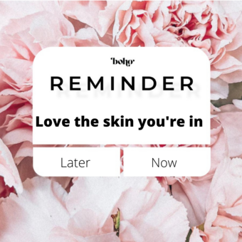 flower background with font that says reminder love the skin you're in