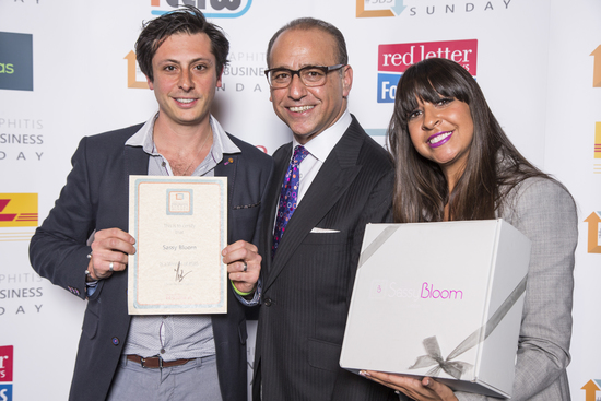 The founders receiving their 21st award from ex Dragon Theo Paphitis