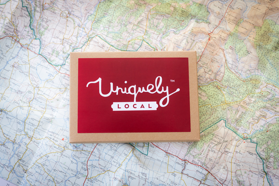 Photo of Uniquely Local Gift Voucher Box against on a North York Moors ordnance survey map
