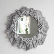 A beautiful macrame wall mirror, handmade using grey 4 ply macrame cotton cord. 