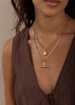 Woman wearing layered necklaces from The 8th Jewellery