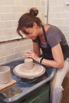 Making mugs at my potter's wheel