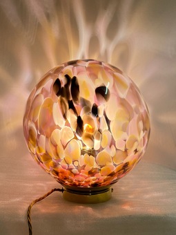 Beautiful hand blown table lamp.  This bespoke blown glass globe features pinks and ambers and can be made in a variety of sizes.