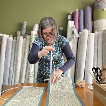 Yvonne making a lined lampshade.